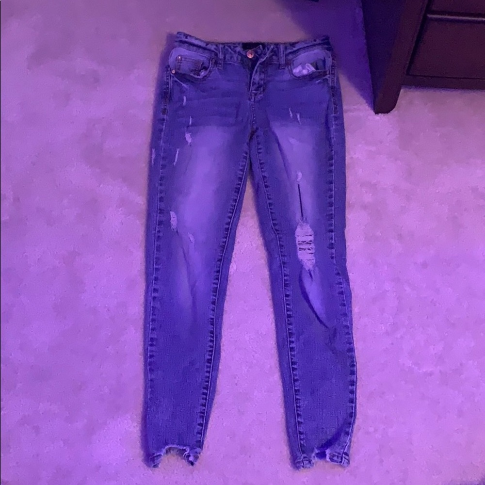 Celebrity pink mid rise ripped skinny jeans